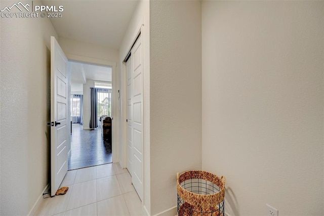 9276 Glitter Way, Colorado Springs, CO 80924 - hallway featuring light tile patterned floors and baseboards
