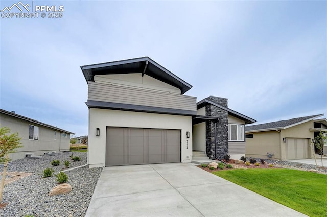 9276 Glitter Way, Colorado Springs, CO 80924 - contemporary home featuring an attached garage, driveway, stucco siding, stone siding, and a front lawn