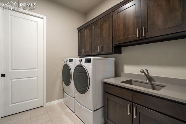 11598 Silver Charm Way, Colorado Springs, CO 80921 - laundry room featuring cabinet space, washer and clothes dryer, and light tile patterned floors