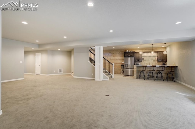 11598 Silver Charm Way, Colorado Springs, CO 80921 - unfurnished living room with recessed lighting, stairs, and light carpet