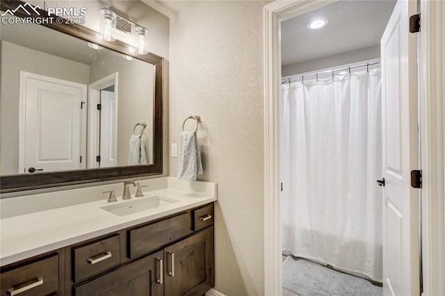 11598 Silver Charm Way, Colorado Springs, CO 80921 - full bathroom featuring vanity and a textured wall