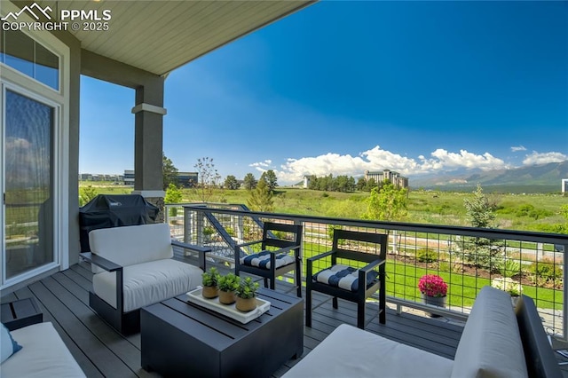 11598 Silver Charm Way, Colorado Springs, CO 80921 - wooden deck with an outdoor living space