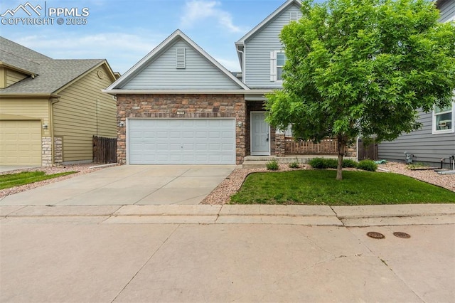 7689 Sniktau Pt, Peyton, CO 80831 - view of front of home featuring driveway, a front lawn, a garage, and stone siding