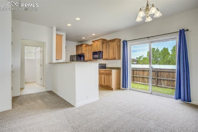 7689 Sniktau Pt, Peyton, CO 80831 - kitchen featuring black microwave, fridge, light carpet, a chandelier, and recessed lighting