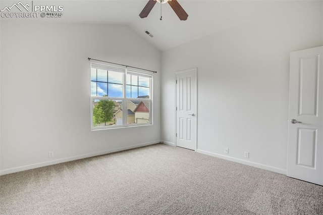7689 Sniktau Pt, Peyton, CO 80831 - unfurnished bedroom featuring light carpet, lofted ceiling, baseboards, and a ceiling fan