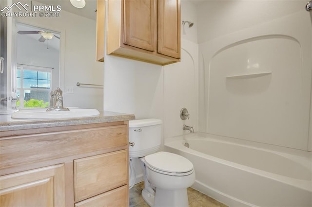 7689 Sniktau Pt, Peyton, CO 80831 - full bath featuring vanity, toilet, a ceiling fan, washtub / shower combination, and tile patterned floors