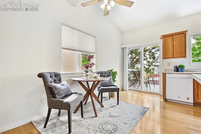 1646 Pinon Glen Cir, Colorado Springs, CO 80919 - dining room with healthy amount of natural light, ceiling fan, light wood-style flooring, baseboards, and high vaulted ceiling