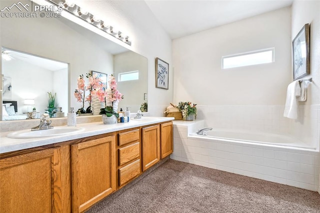 1646 Pinon Glen Cir, Colorado Springs, CO 80919 - bathroom with double vanity, tiled tub, and carpet flooring
