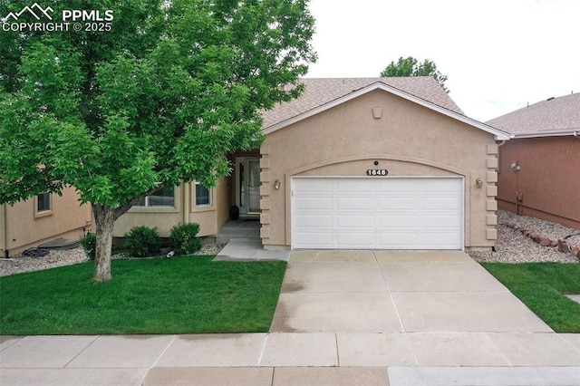 1646 Pinon Glen Cir, Colorado Springs, CO 80919 - view of front of property featuring a garage, stucco siding, driveway, a front lawn, and a shingled roof