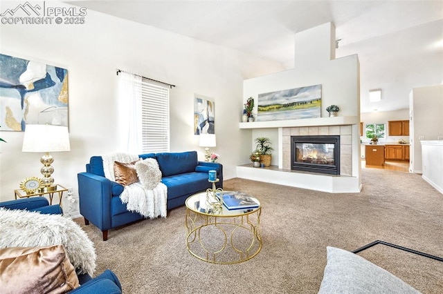 1646 Pinon Glen Cir, Colorado Springs, CO 80919 - carpeted living area featuring a tiled fireplace and baseboards