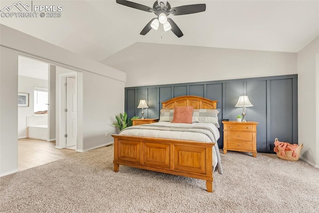 10467 Pictured Rocks Dr, Peyton, CO 80831 - bedroom featuring light colored carpet, vaulted ceiling, a ceiling fan, and ensuite bathroom