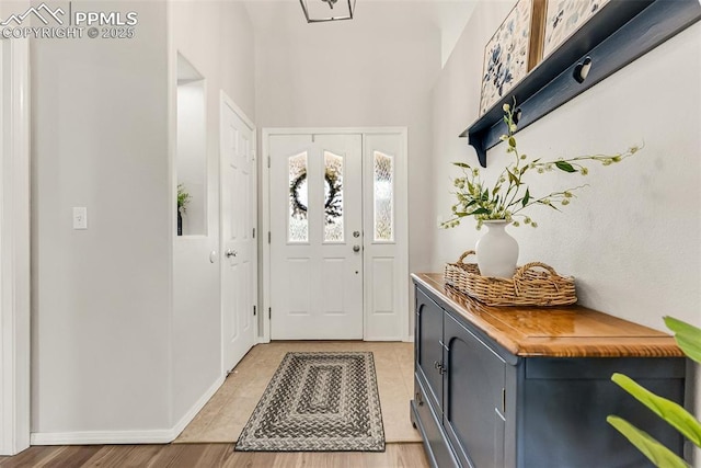 10467 Pictured Rocks Dr, Peyton, CO 80831 - entryway with baseboards and light wood finished floors