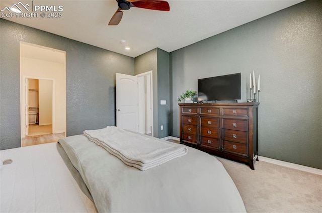 10806 Rolling Peaks Dr, Peyton, CO 80831 - carpeted bedroom with ceiling fan, a textured wall, and baseboards