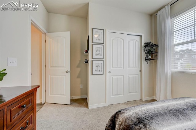 10806 Rolling Peaks Dr, Peyton, CO 80831 - bedroom featuring a closet, light colored carpet, and baseboards