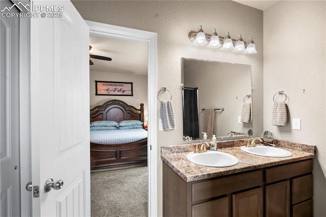 5228 Gannet Ln, Pueblo, CO 81008 - ensuite bathroom with double vanity and ceiling fan