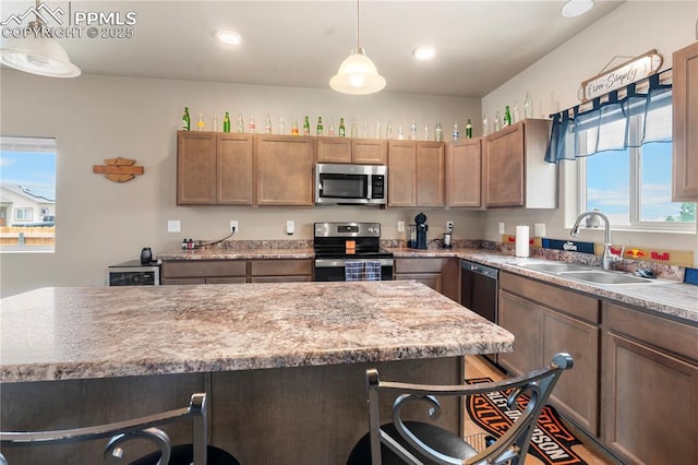 5228 Gannet Ln, Pueblo, CO 81008 - kitchen featuring stainless steel appliances, pendant lighting, light countertops, and recessed lighting