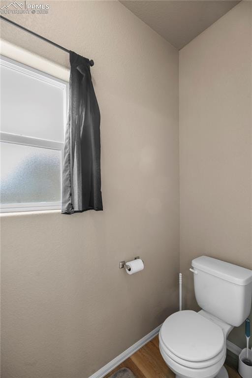 5228 Gannet Ln, Pueblo, CO 81008 - bathroom featuring toilet and wood finished floors