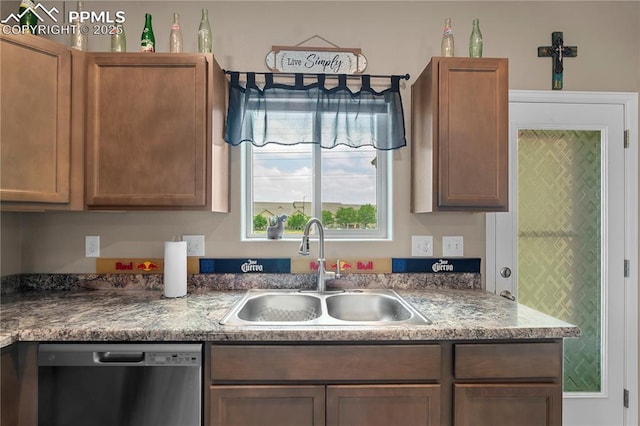 5228 Gannet Ln, Pueblo, CO 81008 - kitchen featuring dishwasher and a sink