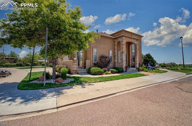 2582 Indian Hills Grv, Colorado Springs, CO 80907 - view of front of house with stucco siding and stone siding