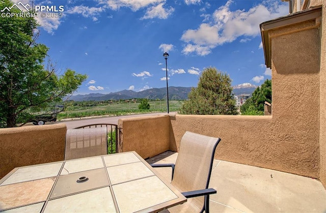 2582 Indian Hills Grv, Colorado Springs, CO 80907 - view of patio / terrace with a mountain view and a balcony