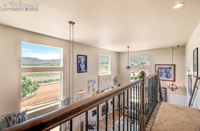 2582 Indian Hills Grv, Colorado Springs, CO 80907 - hall featuring an upstairs landing, wood finished floors, recessed lighting, and a mountain view