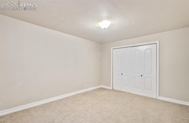2582 Indian Hills Grv, Colorado Springs, CO 80907 - unfurnished bedroom featuring carpet, baseboards, and a closet