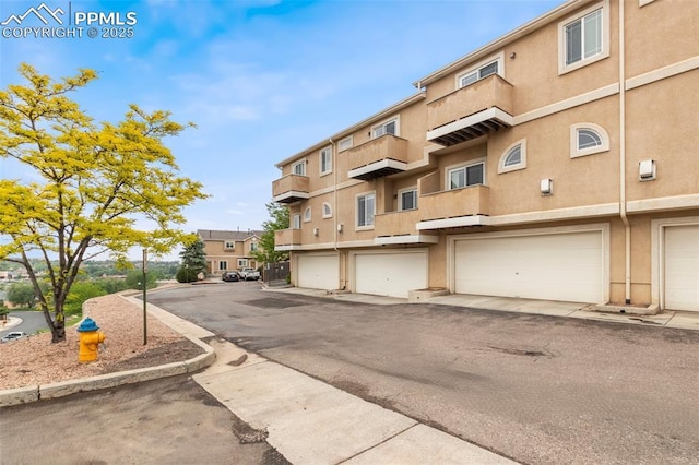 2237 Stepping Stones Way Unit C, Colorado Springs, CO 80904 - view of building exterior featuring a garage