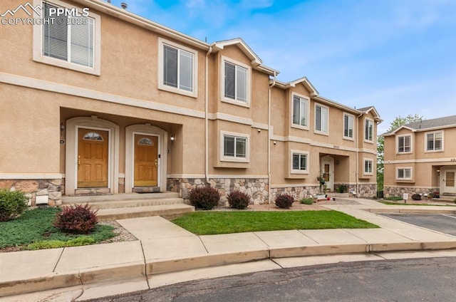 2237 Stepping Stones Way Unit C, Colorado Springs, CO 80904 - view of property with stone siding and stucco siding