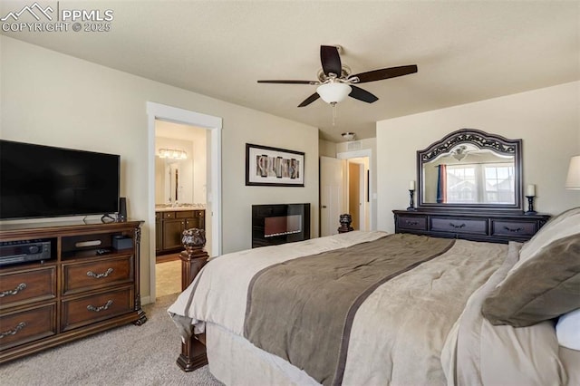 10208 Abrams Dr, Colorado Springs, CO 80925 - bedroom featuring light colored carpet, ensuite bath, and a ceiling fan