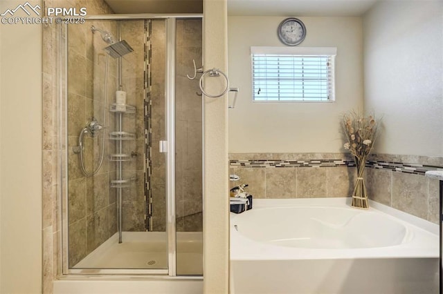 10208 Abrams Dr, Colorado Springs, CO 80925 - bathroom with a bath and a stall shower