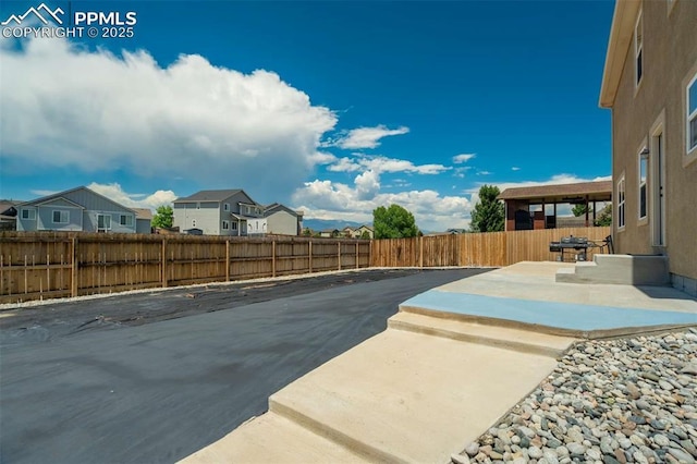 10208 Abrams Dr, Colorado Springs, CO 80925 - view of pool with a patio area, a residential view, and a fenced backyard