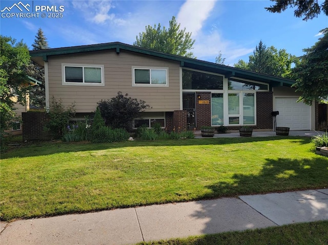 2619 N Arcadia St, Colorado Springs, CO 80907 - split level home with an attached garage and a front yard