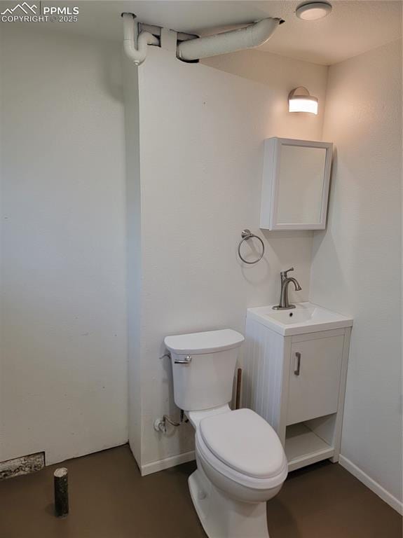 2619 N Arcadia St, Colorado Springs, CO 80907 - bathroom with vanity, toilet, and baseboards