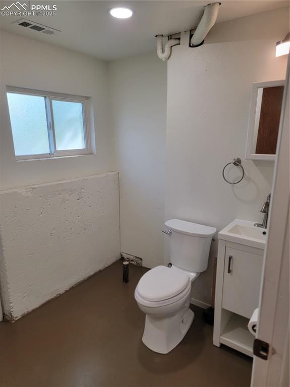 2619 N Arcadia St, Colorado Springs, CO 80907 - bathroom with vanity, toilet, and recessed lighting