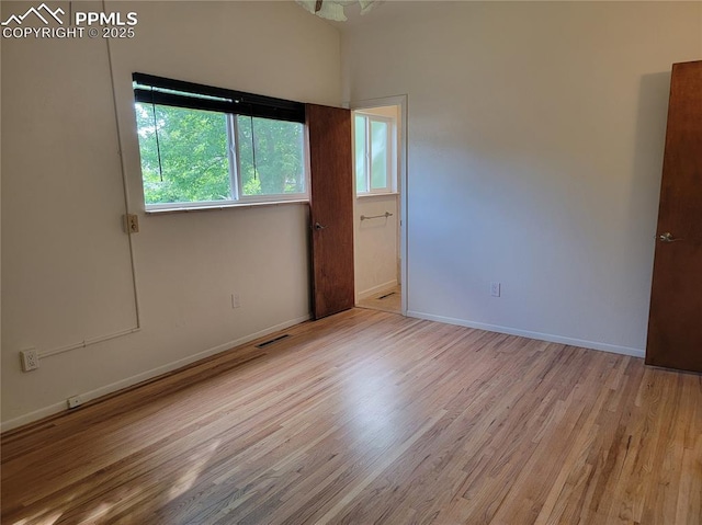 2619 N Arcadia St, Colorado Springs, CO 80907 - empty room with light wood-style floors and baseboards