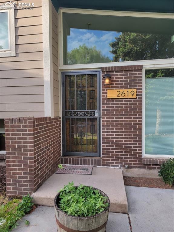 2619 N Arcadia St, Colorado Springs, CO 80907 - doorway to property with brick siding