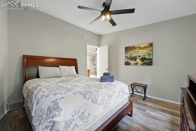 4840 Pikes Peak Hwy, Cascade, CO 80809 - bedroom with baseboards, wood finished floors, and ceiling fan