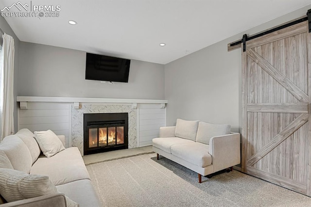 5870 S Perth Pl, Centennial, CO 80015 - living area featuring a barn door, carpet flooring, recessed lighting, and a glass covered fireplace