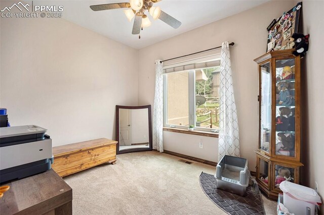 20280 Melanie Ann Ct, Monument, CO 80132 - living area featuring carpet flooring, a ceiling fan, and baseboards