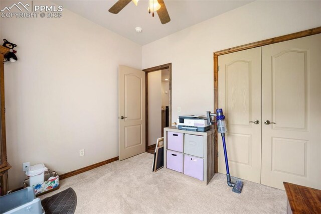20280 Melanie Ann Ct, Monument, CO 80132 - unfurnished bedroom with light carpet, a ceiling fan, baseboards, and a closet