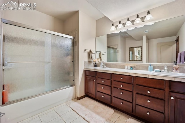 20280 Melanie Ann Ct, Monument, CO 80132 - full bath with tile patterned floors, shower / bath combination with glass door, and double vanity