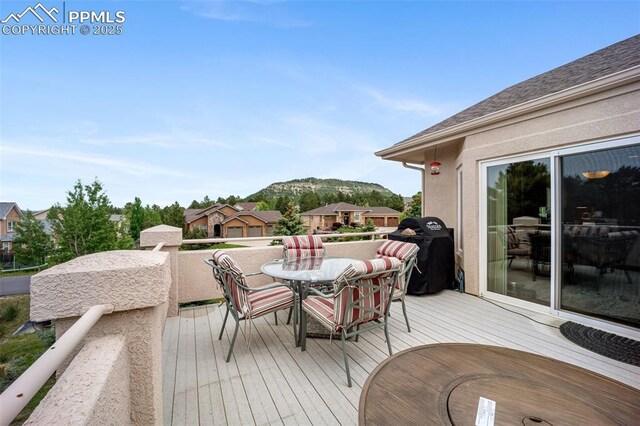 20280 Melanie Ann Ct, Monument, CO 80132 - wooden deck featuring a mountain view and area for grilling