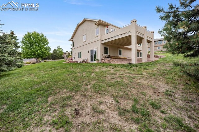 20280 Melanie Ann Ct, Monument, CO 80132 - rear view of property with a lawn, a deck, and stucco siding