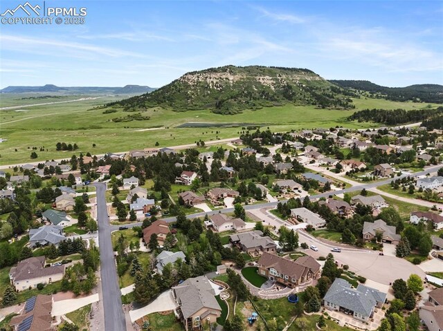 20280 Melanie Ann Ct, Monument, CO 80132 - aerial overview of property's location with a mountain backdrop and nearby suburban area