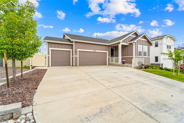 13138 Stoney Meadows Way, Peyton, CO 80831 - ranch-style home featuring board and batten siding, a garage, concrete driveway, and covered porch