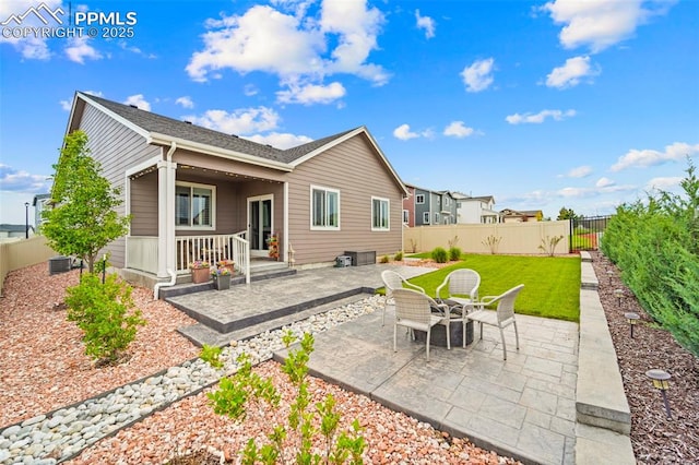 13138 Stoney Meadows Way, Peyton, CO 80831 - back of property with a patio area, a fenced backyard, and central AC