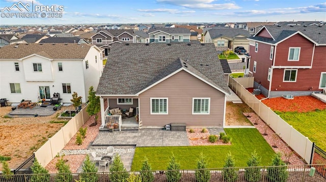13138 Stoney Meadows Way, Peyton, CO 80831 - rear view of house with a residential view, a patio area, and a shingled roof
