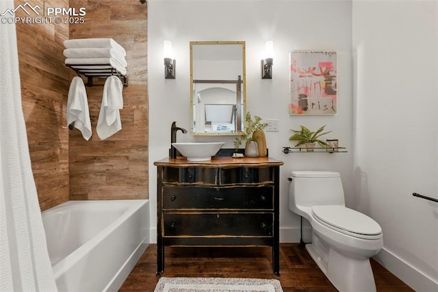 3320 Camels Ridge Ln, Colorado Springs, CO 80904 - full bath with vanity, wood finished floors, and shower / bathtub combination with curtain