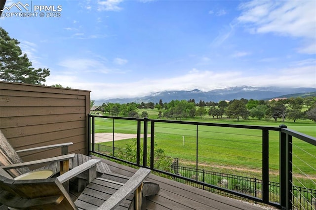 3320 Camels Ridge Ln, Colorado Springs, CO 80904 - wooden deck with a mountain view and a lawn