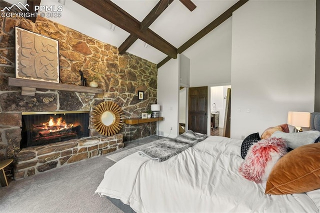 3320 Camels Ridge Ln, Colorado Springs, CO 80904 - bedroom with high vaulted ceiling, beamed ceiling, carpet floors, and a fireplace